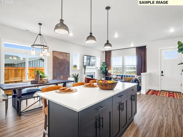 a kitchen with sink cabinets and wooden floor