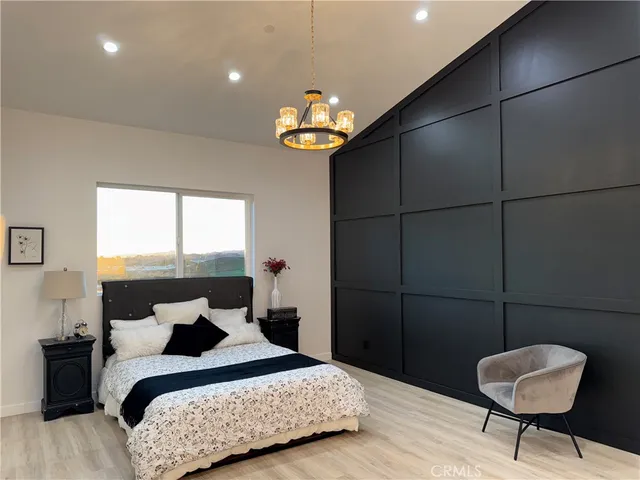 a bedroom with bed and a window