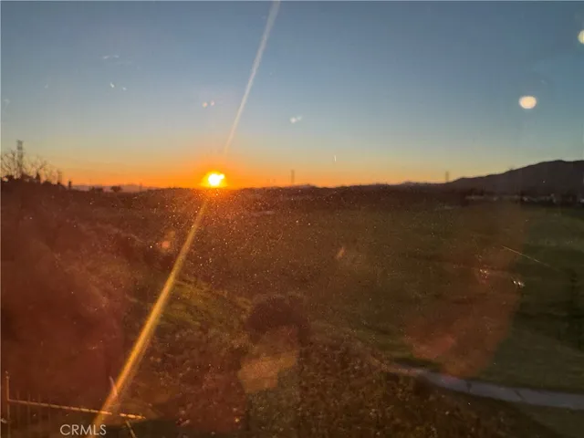 a view of an outdoor space and mountains in the background