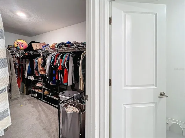 a view of a closet with storage