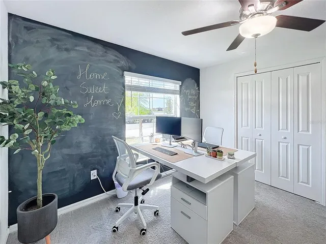 a workspace with furniture and potted plant