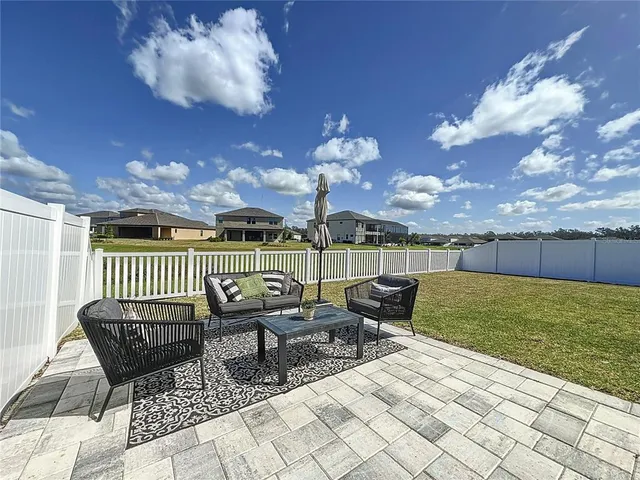 a view of a patio with furniture