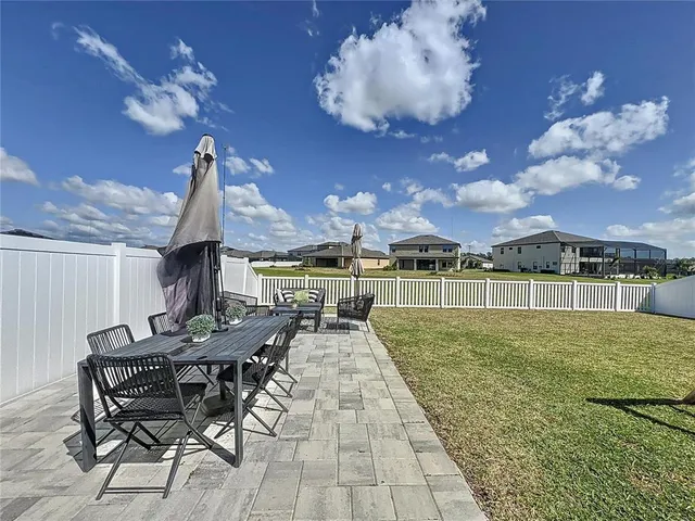 a view of a swimming pool with seating space