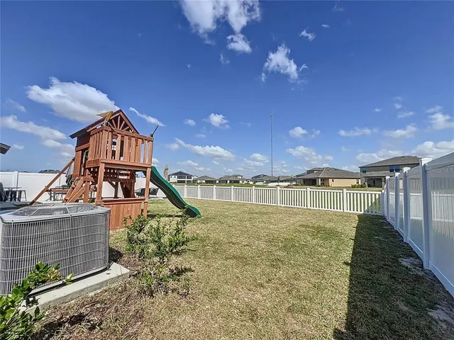 a view of a house with a swimming pool