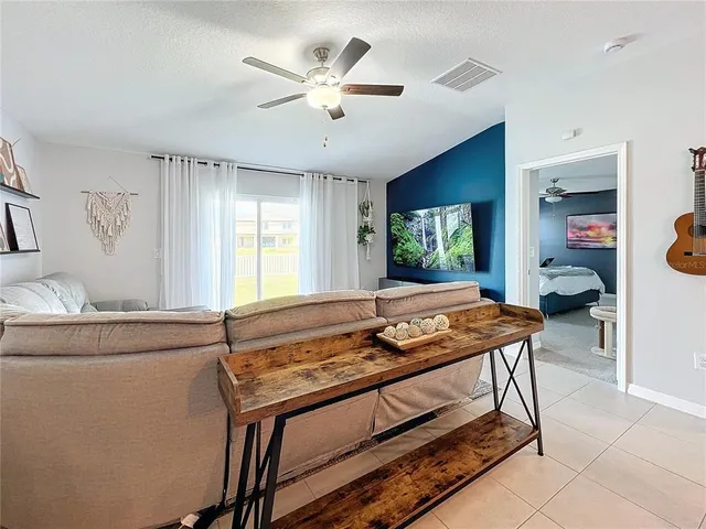 a living room with furniture and a table