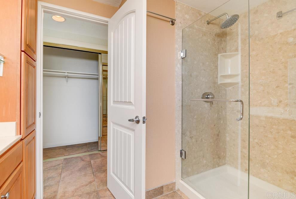 640 West Solana Circle, Unit 1 Solana Beach, CA 92075 - Photo 37 of 42 a bathroom with a shower and a glass door
