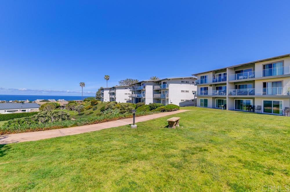 640 West Solana Circle, Unit 1 Solana Beach, CA 92075 - Photo 9 of 42 a view of a house with a yard and sitting area