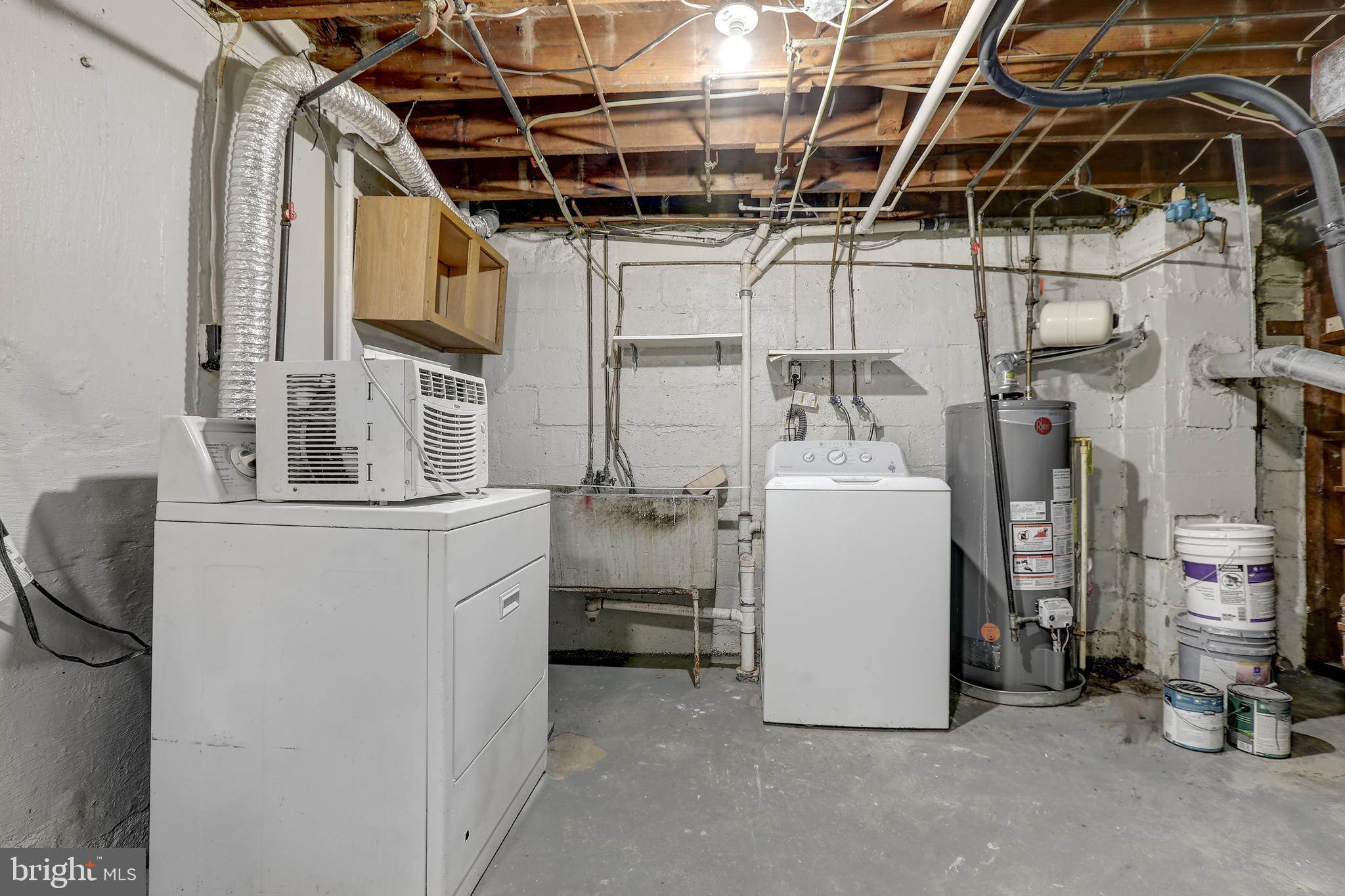 1714 Pin Oak Road Parkville, MD 21234 - Photo 31 of 41 Utility Rm w/ washer/dryer & walkup stairs to yard