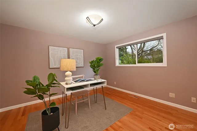 a workspace with furniture and a potted plant