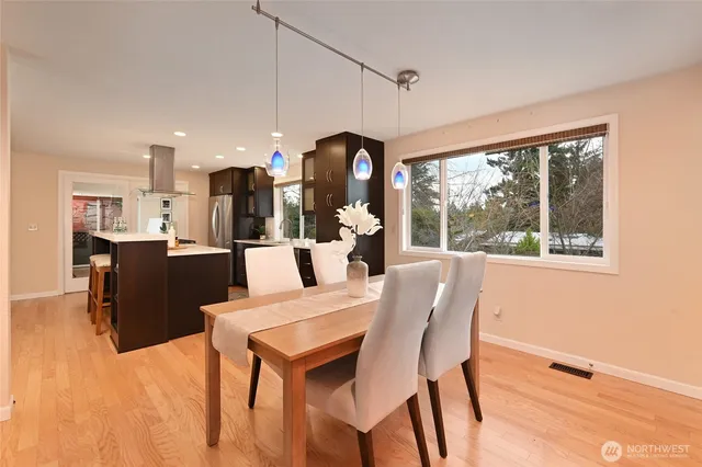 a dining room with furniture and window