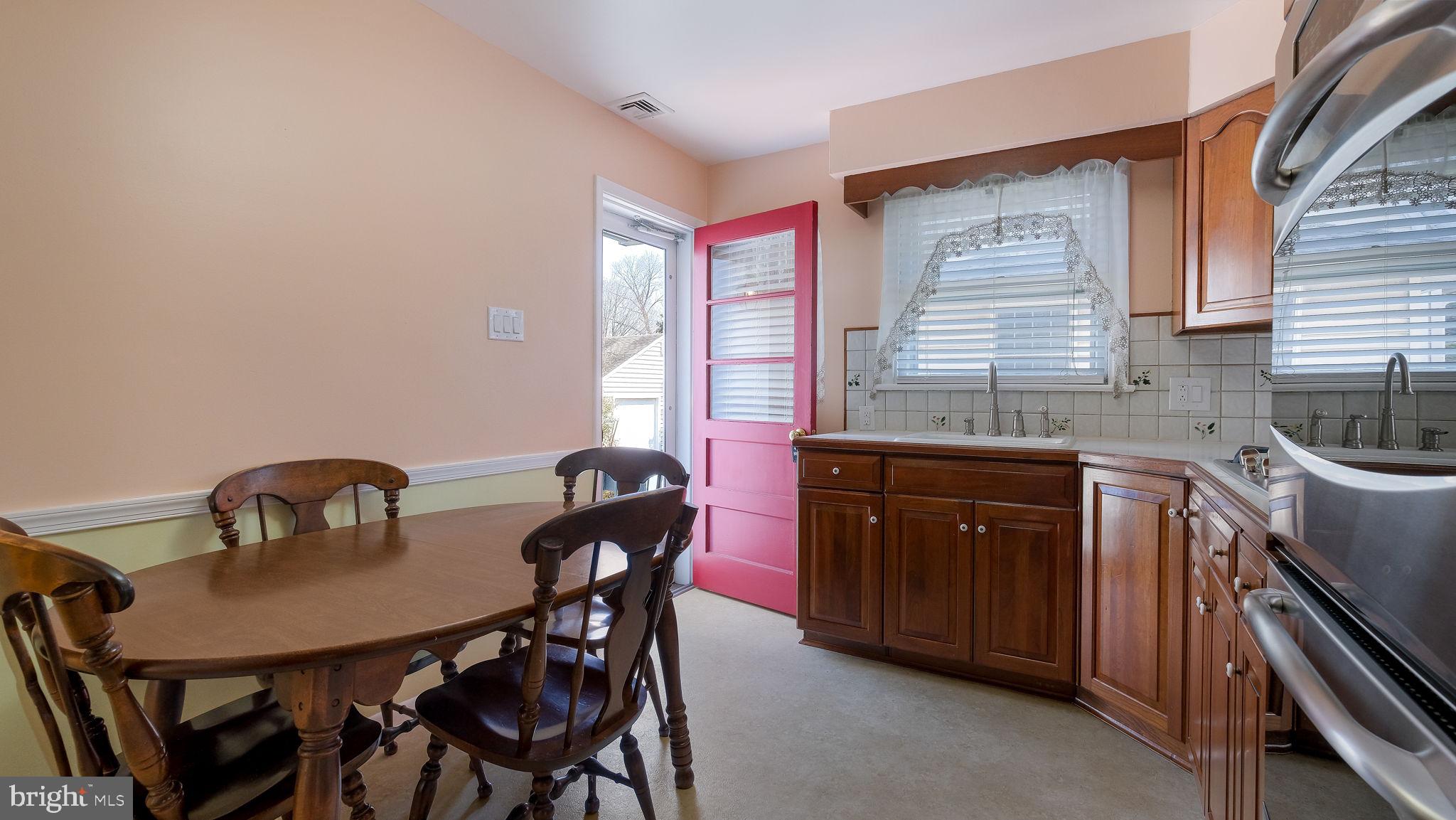 2473 Susquehanna Road Abington, PA 19001 - Photo 13 of 46 a kitchen with a table chairs a sink and dishwasher