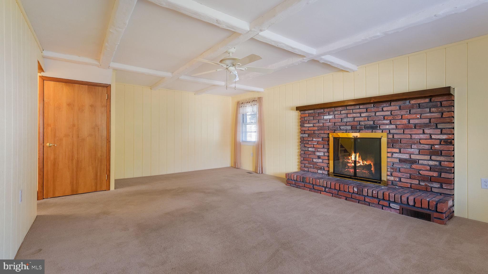 2473 Susquehanna Road Abington, PA 19001 - Photo 16 of 46 a view of an empty room with a fireplace and a window