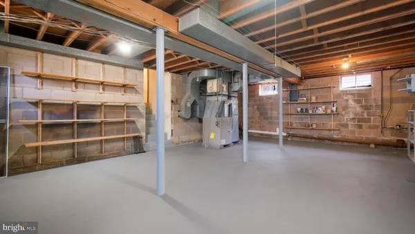 a view of an empty room with a ceiling fan