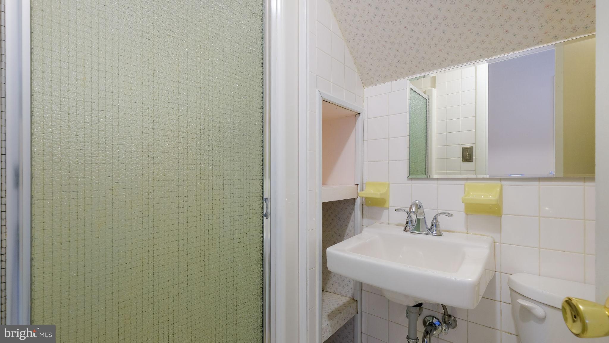 2473 Susquehanna Road Abington, PA 19001 - Photo 30 of 46 a bathroom with a sink and a mirror