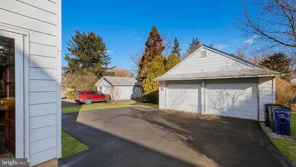 a view of a house with a yard and garage