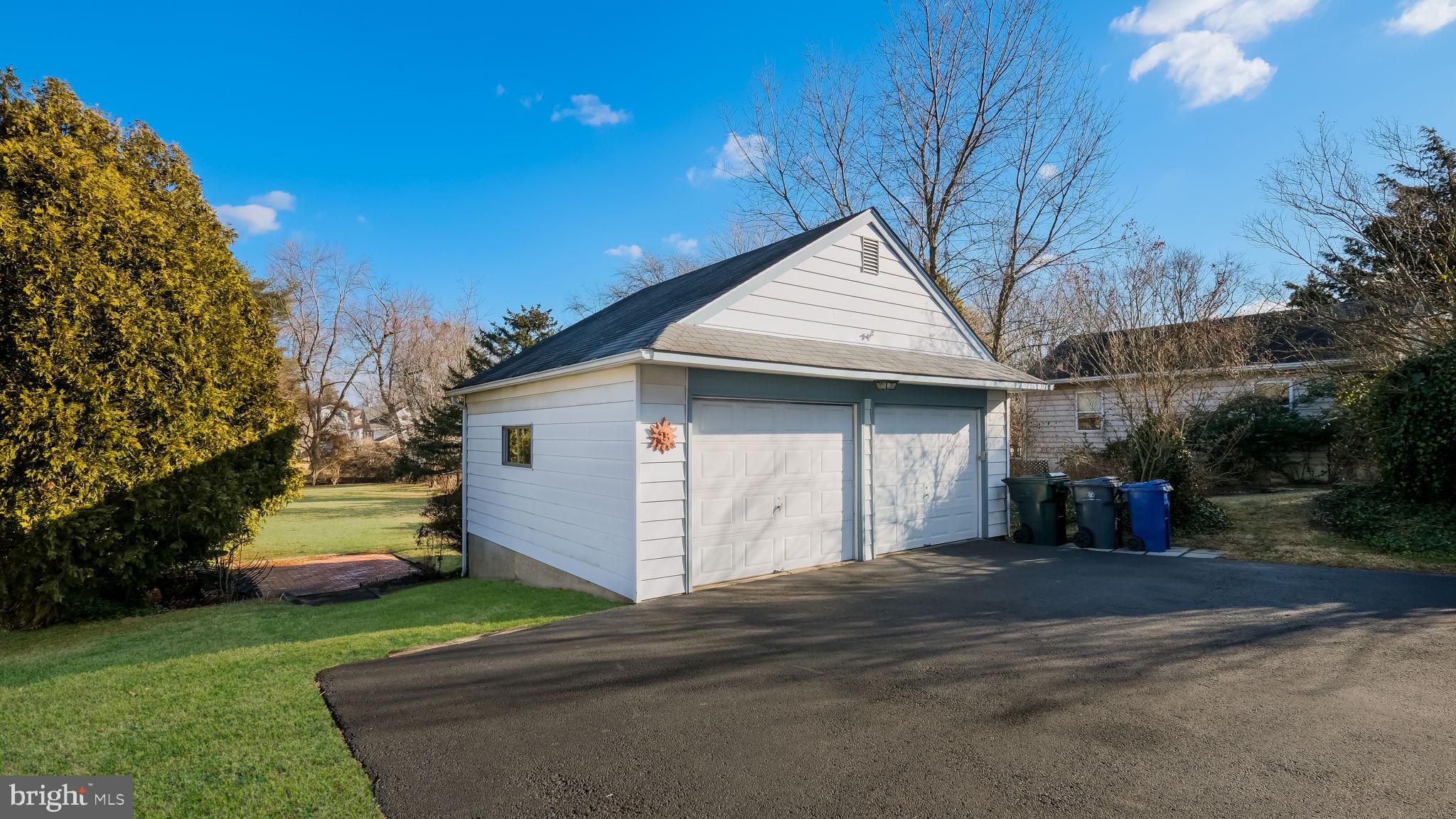 2473 Susquehanna Road Abington, PA 19001 - Photo 36 of 46 a front view of a house with a yard and garage