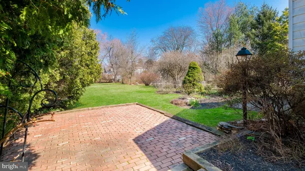 a view of a garden with a house