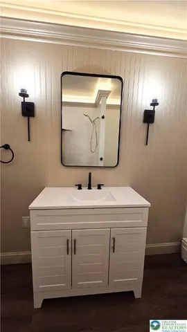 a bathroom with a sink and a mirror