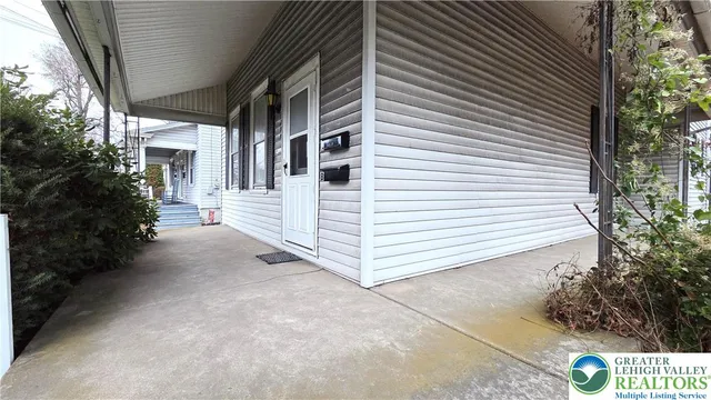 a view of a house with a yard and garage