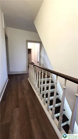 a view of wooden floor and staircase