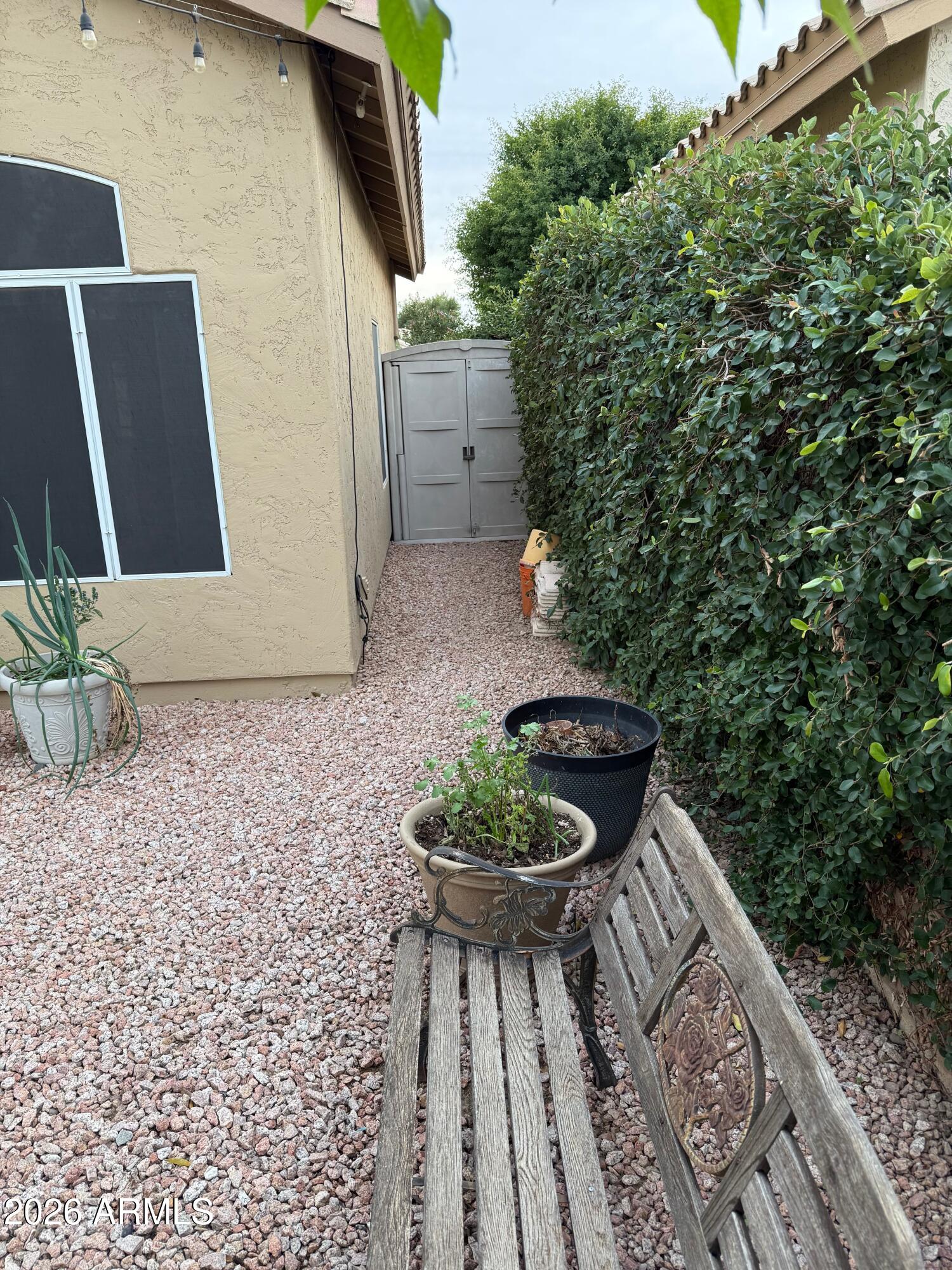 3426 East Clark Road Phoenix, AZ 85050 - Photo 43 of 48 a backyard of a house with yard and outdoor seating