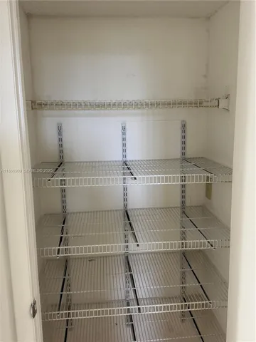 view of a room with racks on the wall