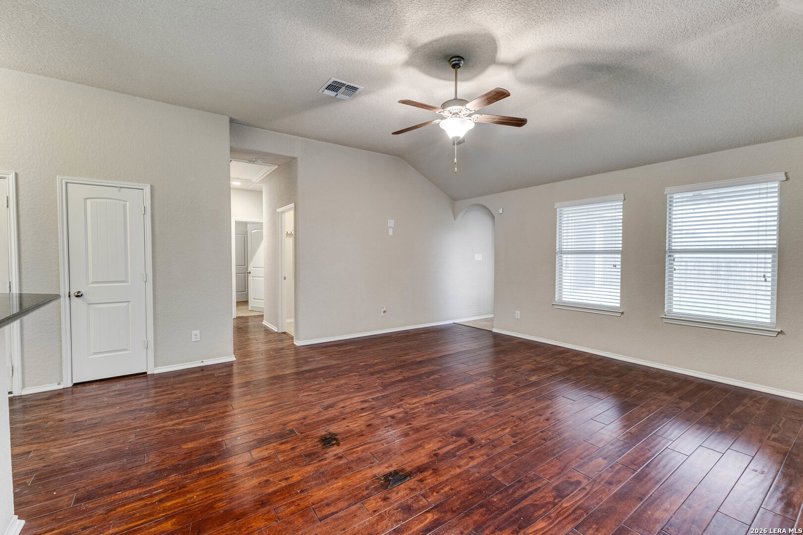 348 Buckboard Lane Cibolo, TX 78108 - Photo 12 of 23 a view of an empty room with wooden floor and a window