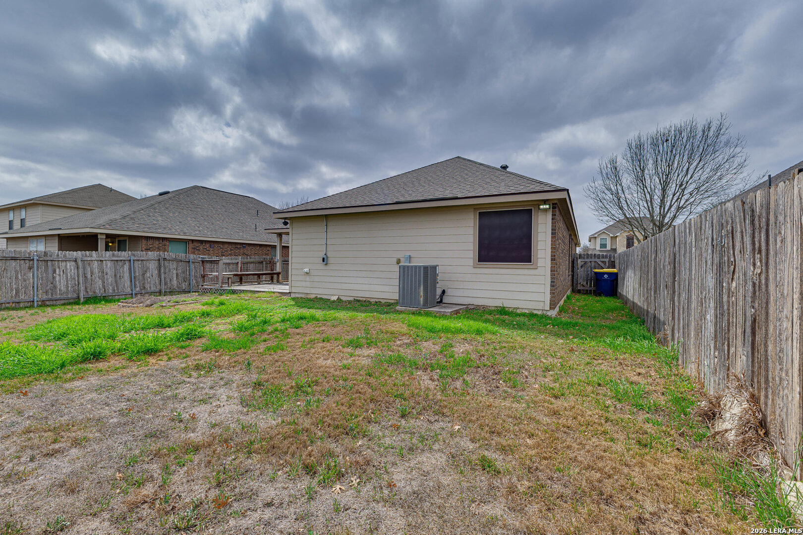 348 Buckboard Lane Cibolo, TX 78108 - Photo 18 of 23 a backyard of a house with lots of green space