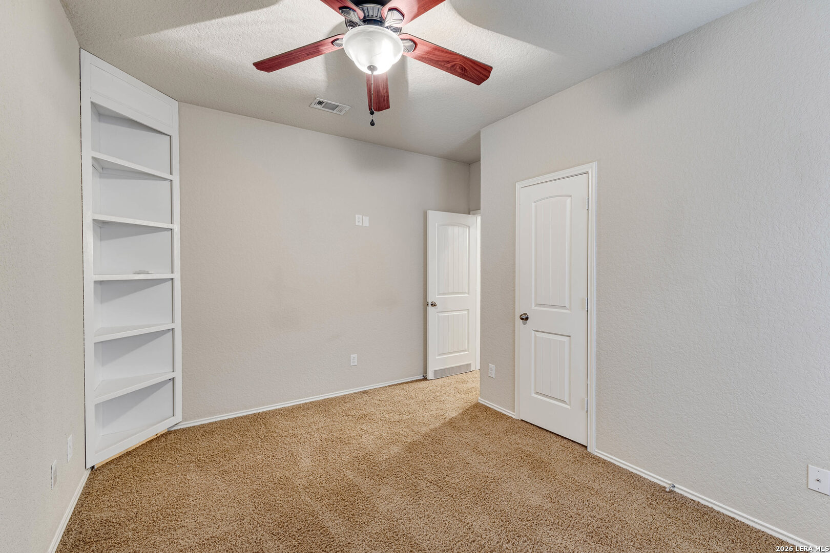 348 Buckboard Lane Cibolo, TX 78108 - Photo 7 of 23 a view of an empty room and a ceiling fan