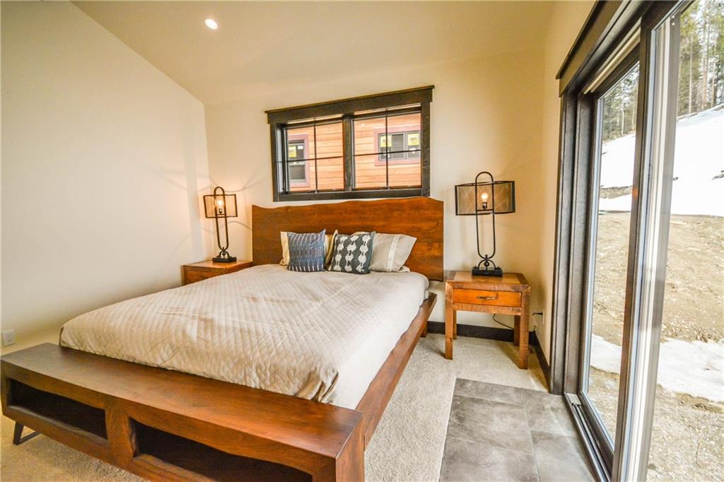 747 Independence Road, Unit 14C Keystone, CO 80435 - Photo 19 of 25 a bed sitting in a bedroom next to a window