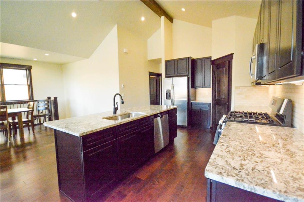 747 Independence Road, Unit 14C Keystone, CO 80435 - Photo 6 of 25 a kitchen with stainless steel appliances granite countertop a sink stove and refrigerator