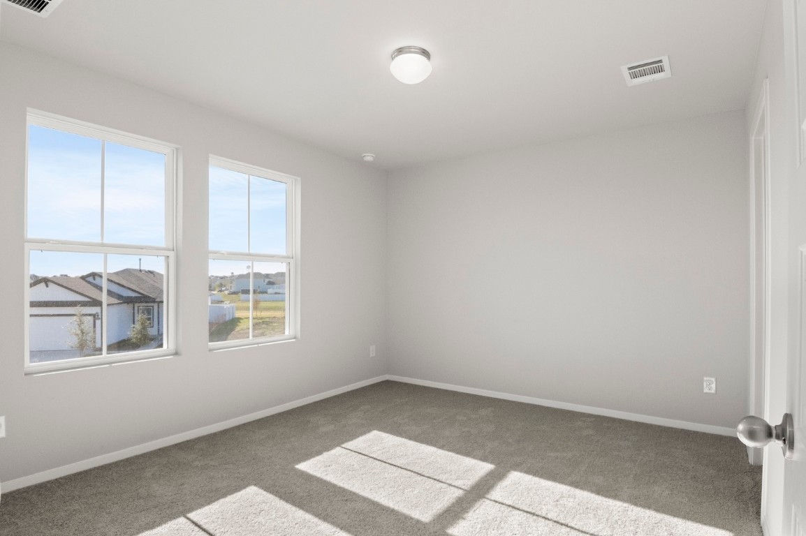 123 Daylily Drive Elgin, TX 78621 - Photo 23 of 33 an empty room with a window