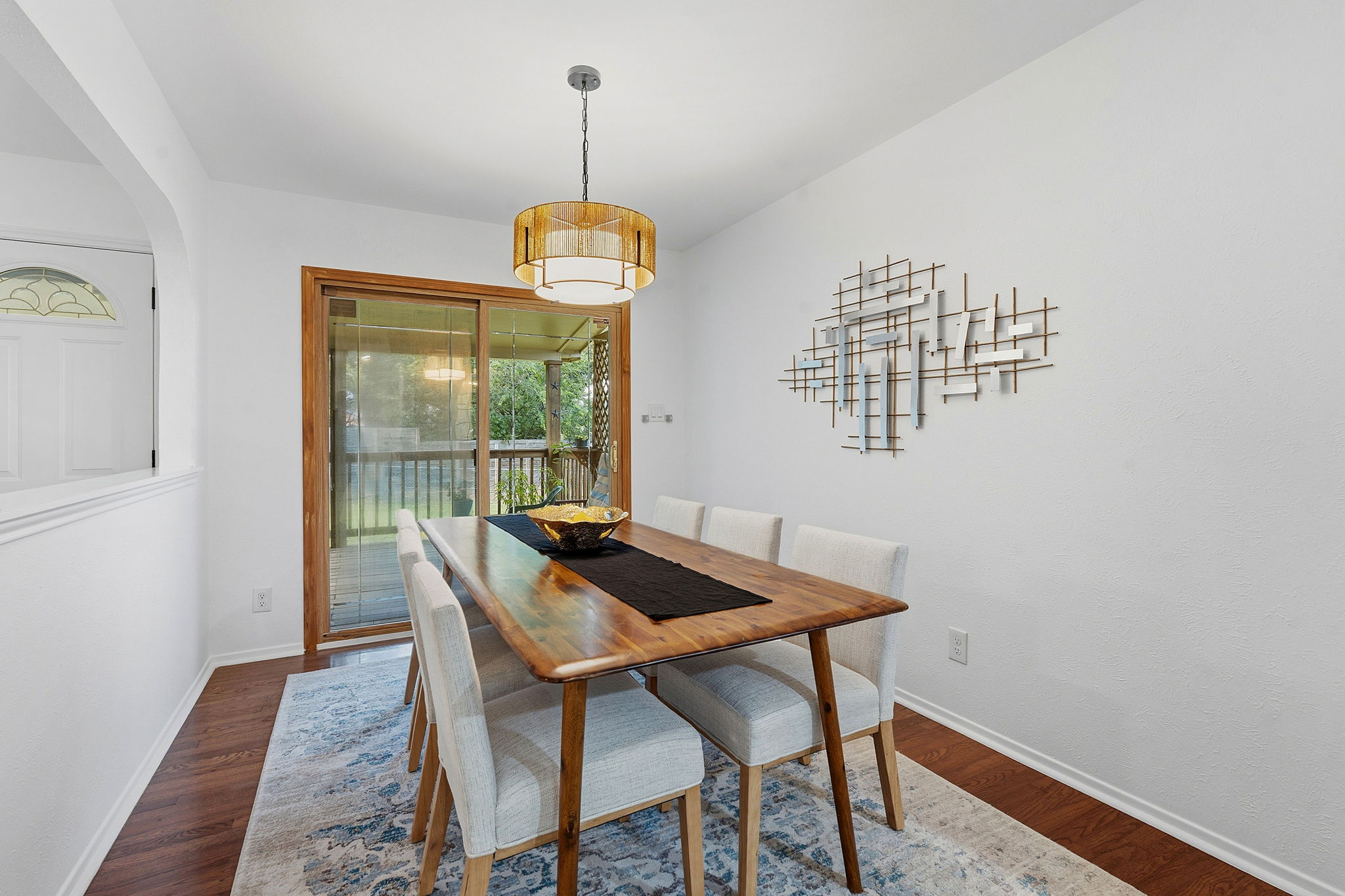 2702 Calabash Cove Austin, TX 78745 - Photo 20 of 40 a view of a dining room with furniture wooden floor and chandelier