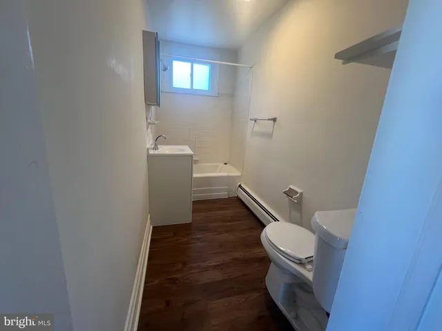 a bathroom with a sink and toilet