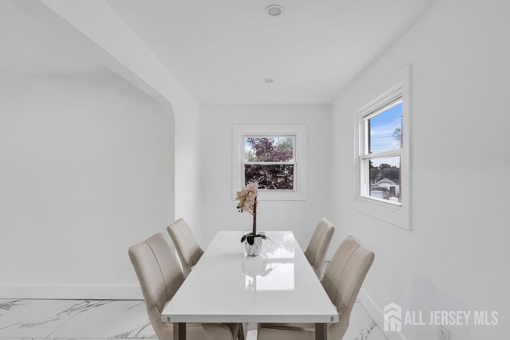 99 Crestview Road Fords, NJ 08863 - Photo 13 of 36 a view of a dining room with furniture and wooden floor