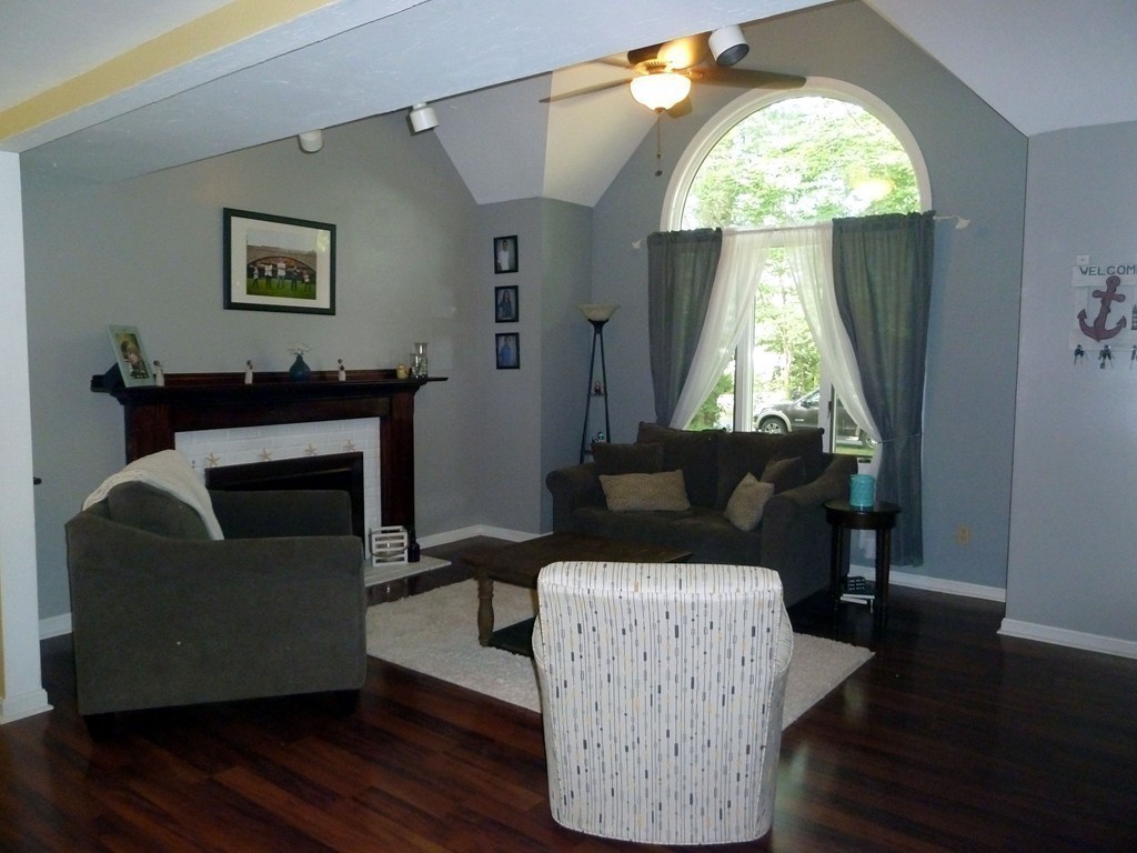 80 Edgewater Road Mashpee, MA 02649 - Photo 11 of 19 a living room with furniture and a fireplace
