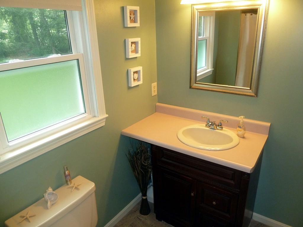 80 Edgewater Road Mashpee, MA 02649 - Photo 7 of 19 a bathroom with a sink and a mirror