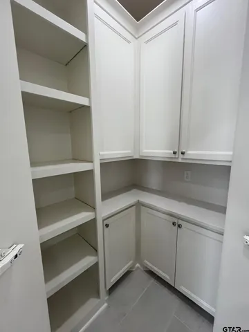 a view of an empty walk in closet