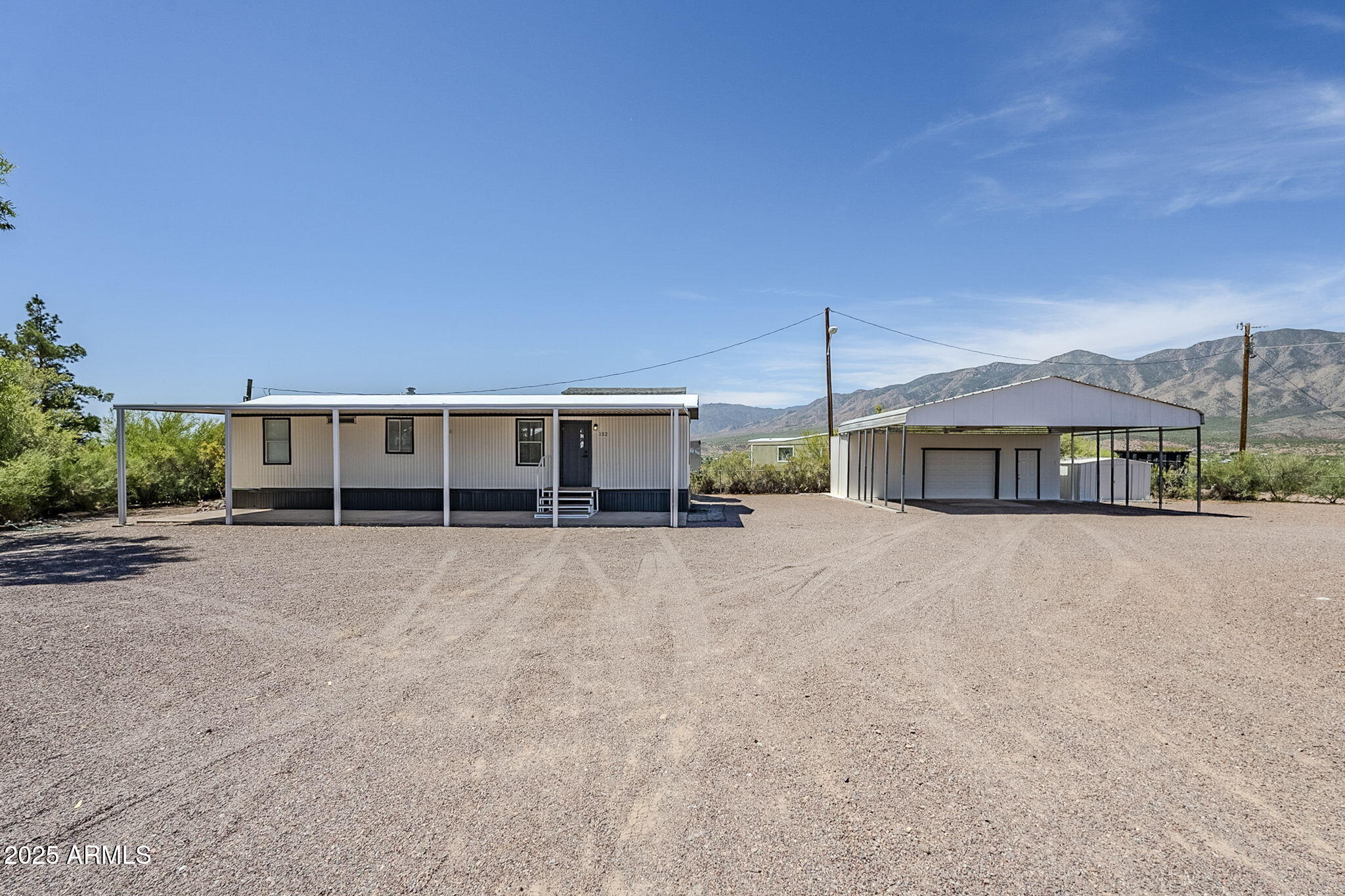 152 Scott Circle Tonto Basin, AZ 85553 - Photo 1 of 51 a view of a house with a yard and balcony