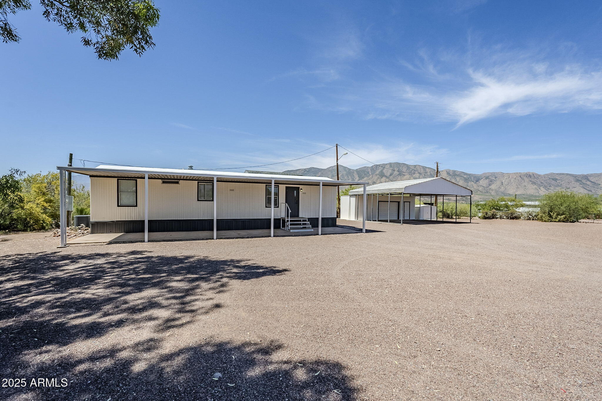 152 Scott Circle Tonto Basin, AZ 85553 - Photo 2 of 51 a front view of a house with a yard
