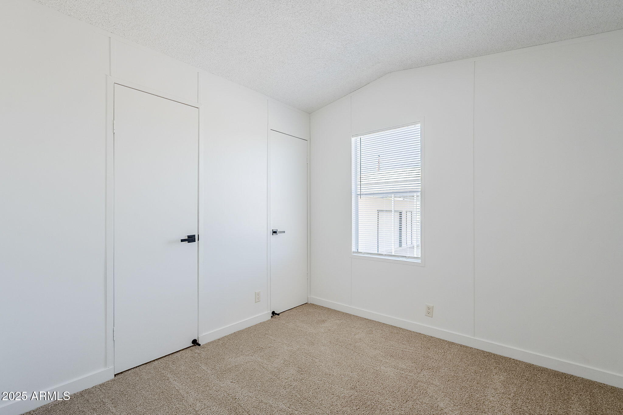 152 Scott Circle Tonto Basin, AZ 85553 - Photo 29 of 51 an empty room with windows and closet