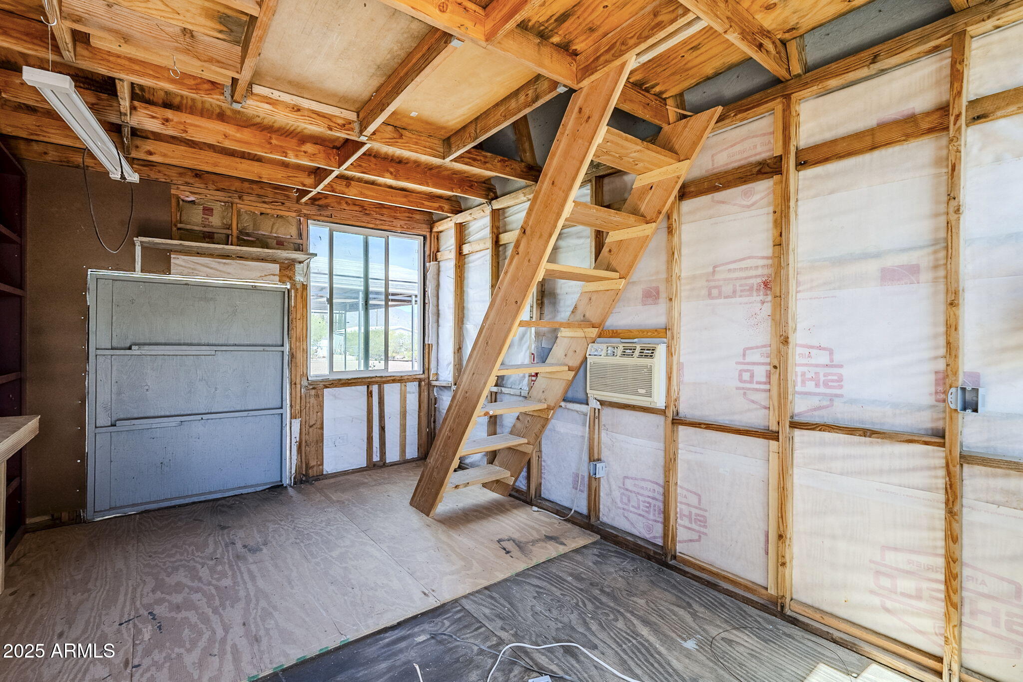 152 Scott Circle Tonto Basin, AZ 85553 - Photo 38 of 51 a view of an empty room with wooden floor
