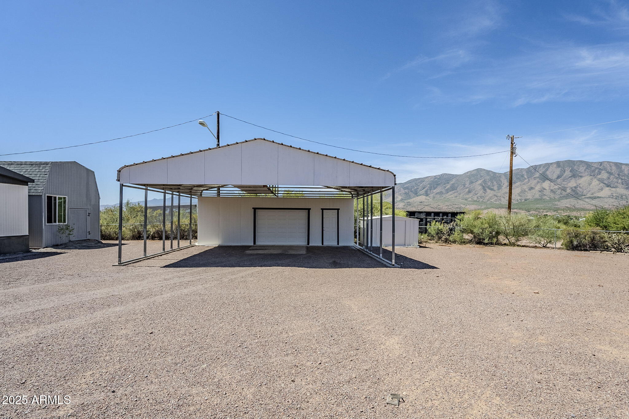 152 Scott Circle Tonto Basin, AZ 85553 - Photo 4 of 51 a view of a house with a yard and potted plants