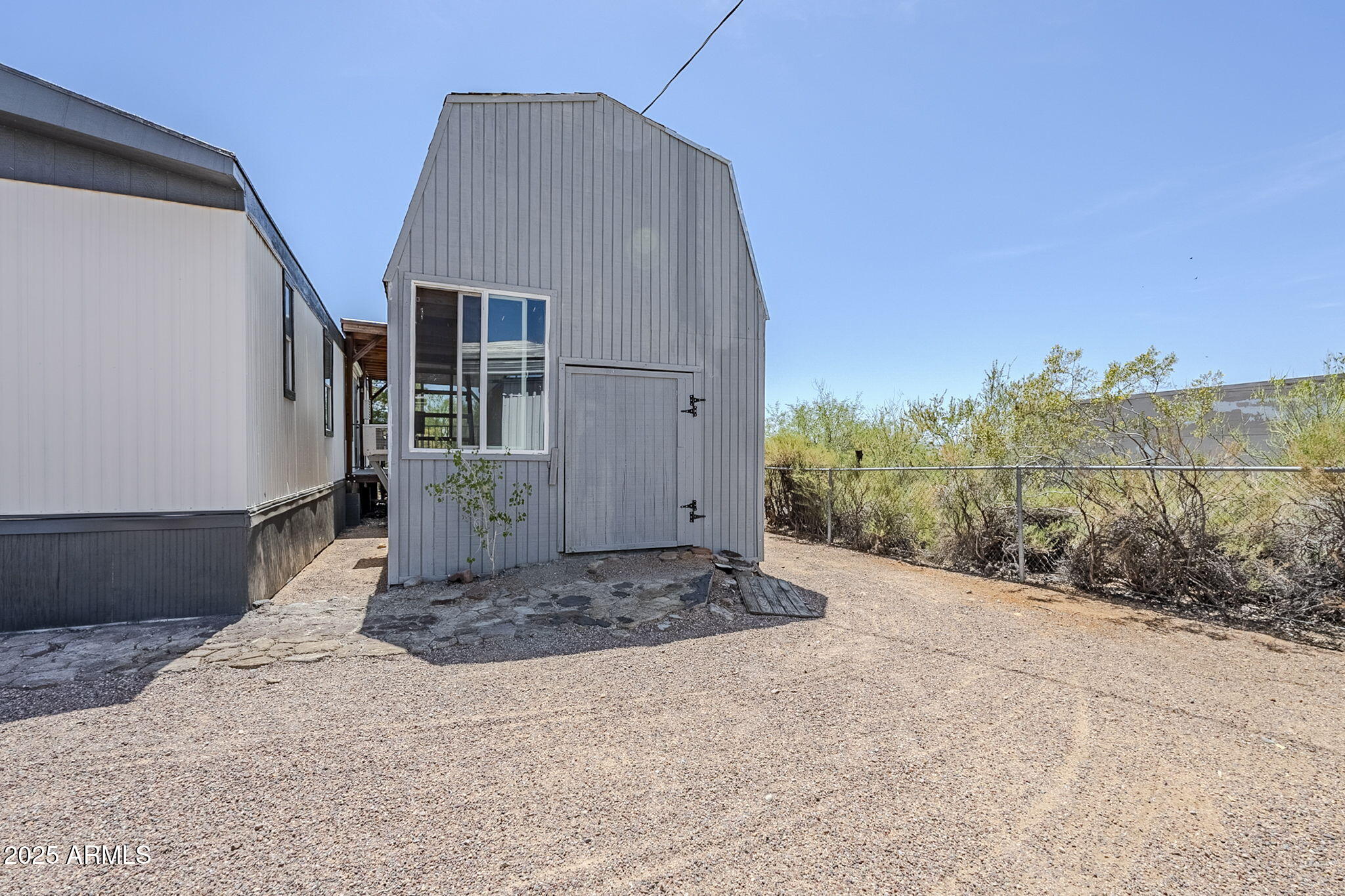 152 Scott Circle Tonto Basin, AZ 85553 - Photo 41 of 51 a front view of a house with plants