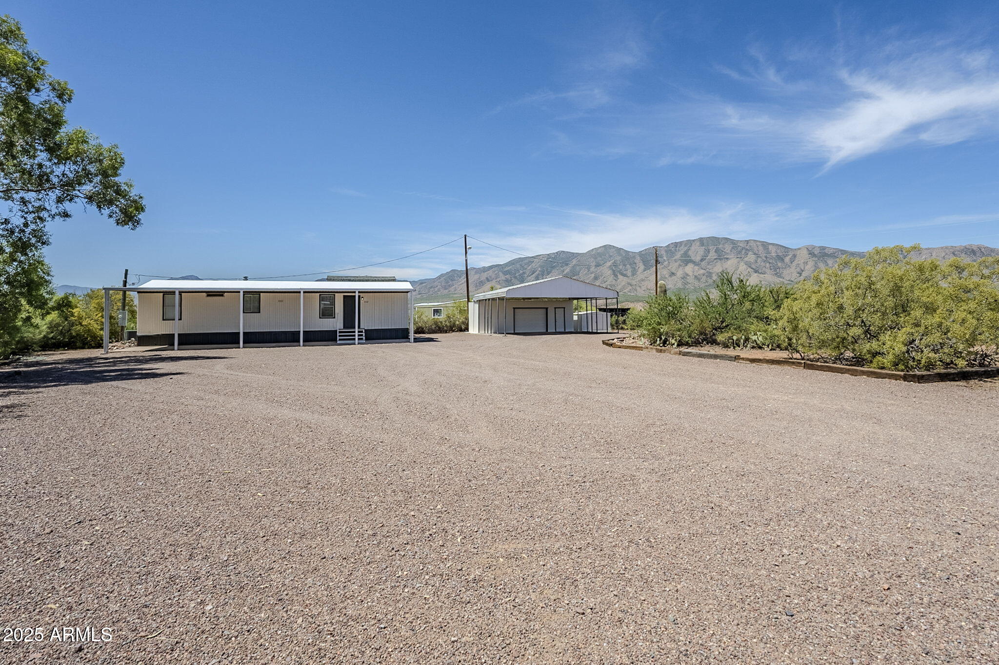 152 Scott Circle Tonto Basin, AZ 85553 - Photo 42 of 51 a view of a house with a street