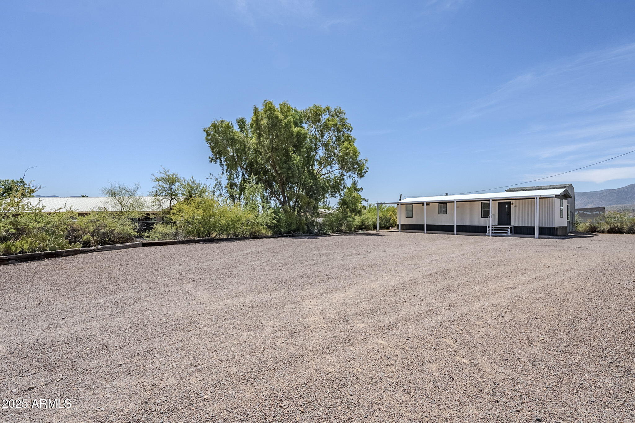 152 Scott Circle Tonto Basin, AZ 85553 - Photo 43 of 51 a view of a house with a yard
