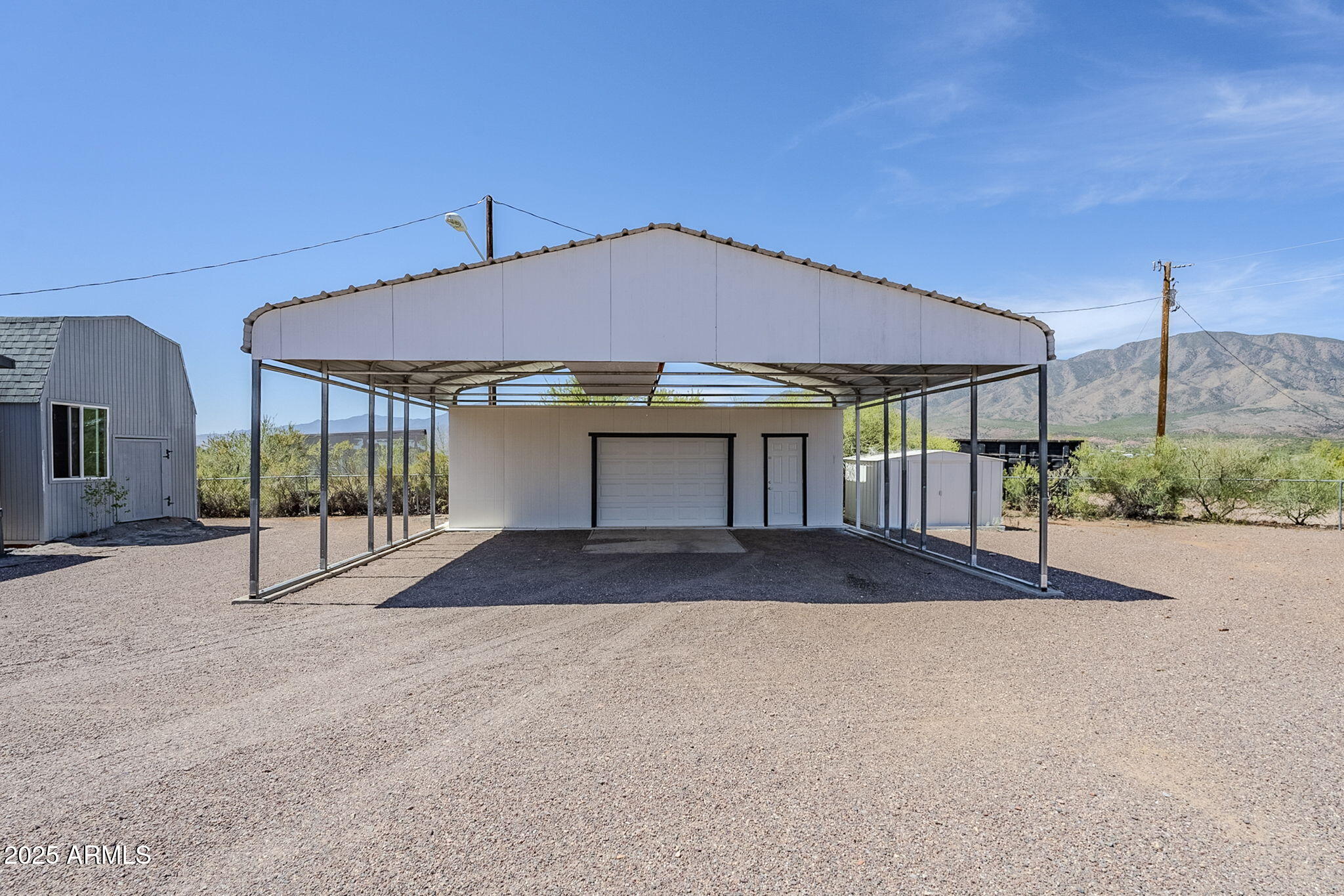 152 Scott Circle Tonto Basin, AZ 85553 - Photo 6 of 51 a view of a house with a yard and garage