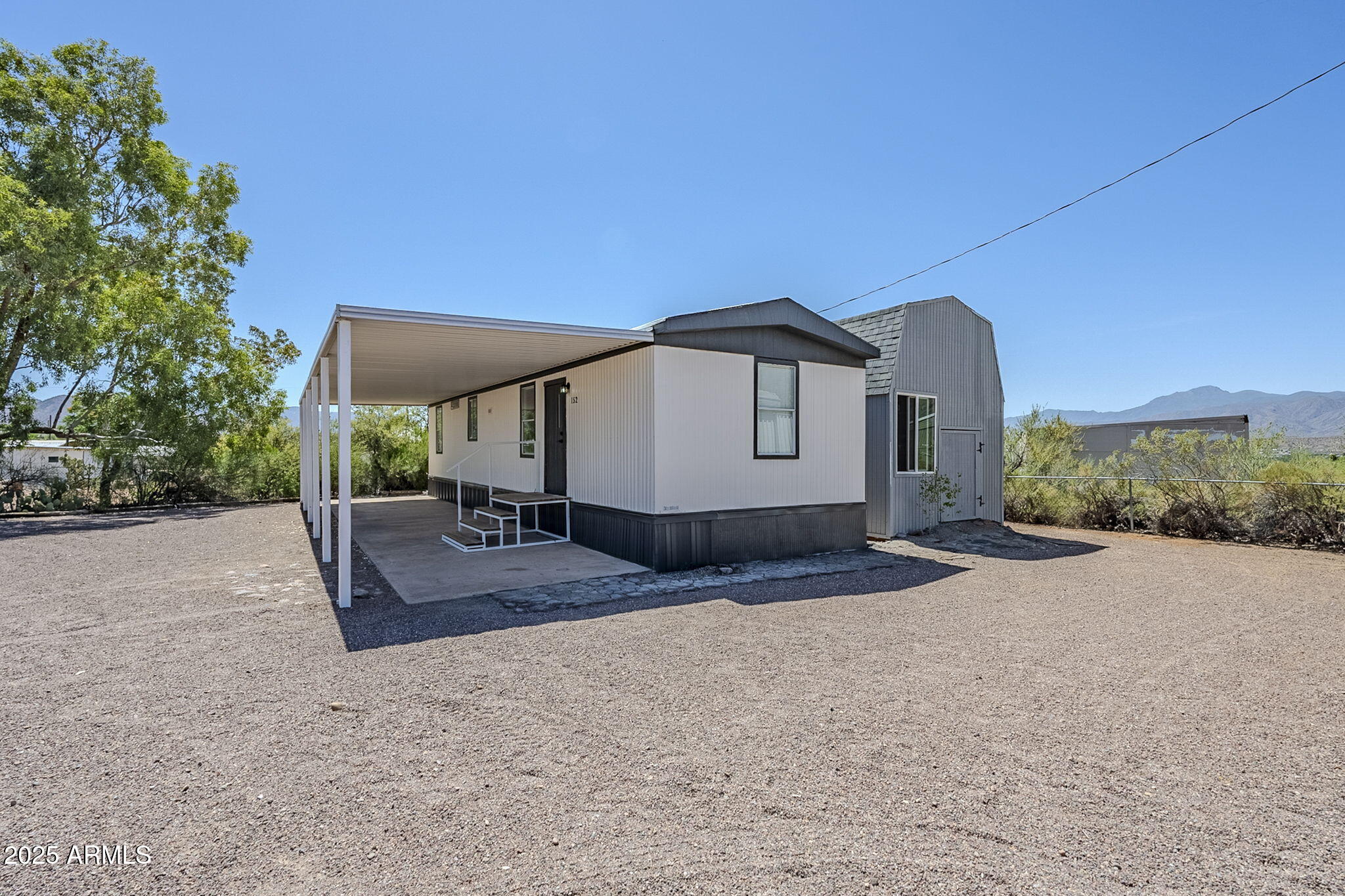 152 Scott Circle Tonto Basin, AZ 85553 - Photo 7 of 51 a view of a house with backyard and trees