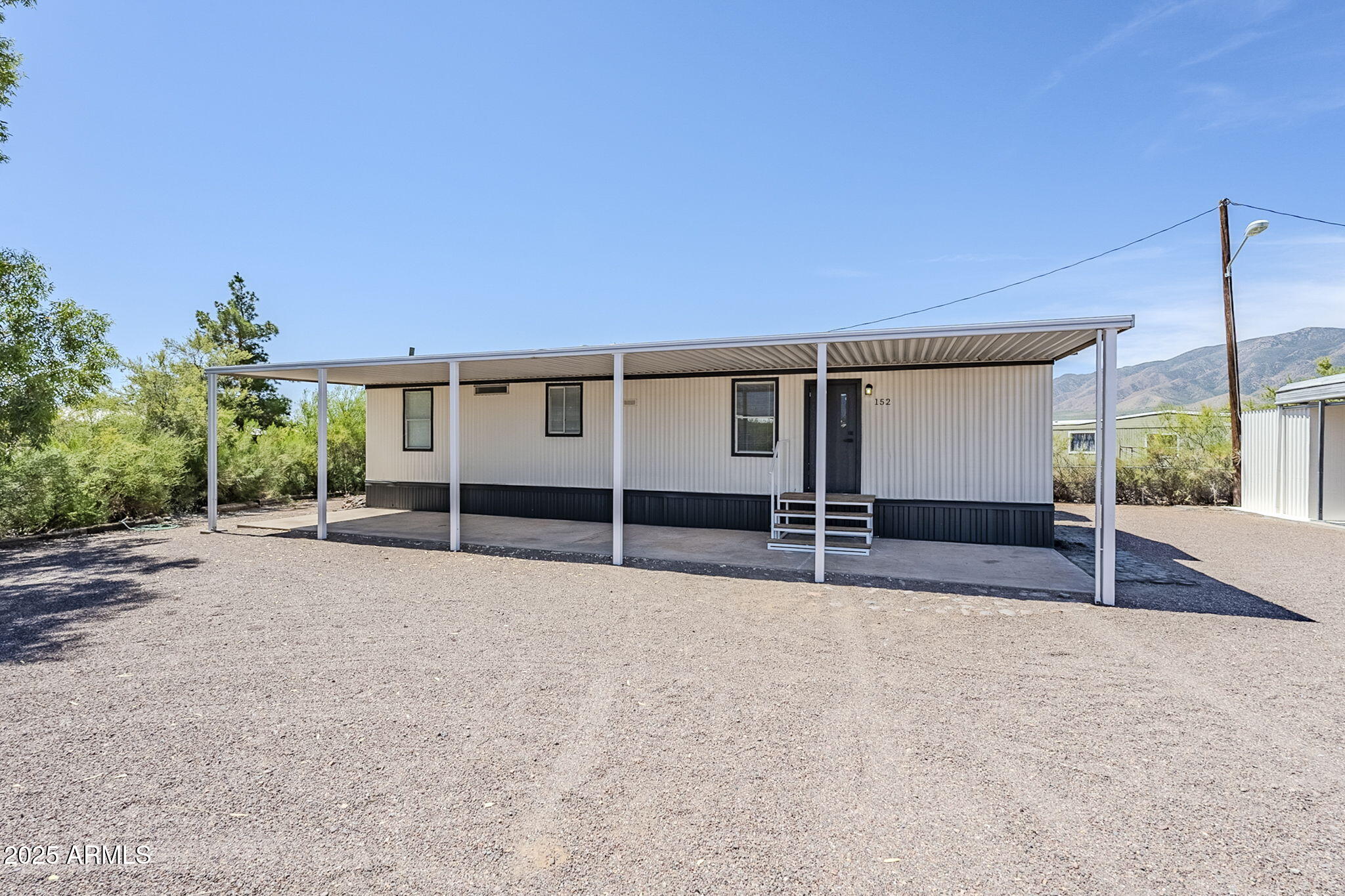 152 Scott Circle Tonto Basin, AZ 85553 - Photo 8 of 51 a view of a house with a patio