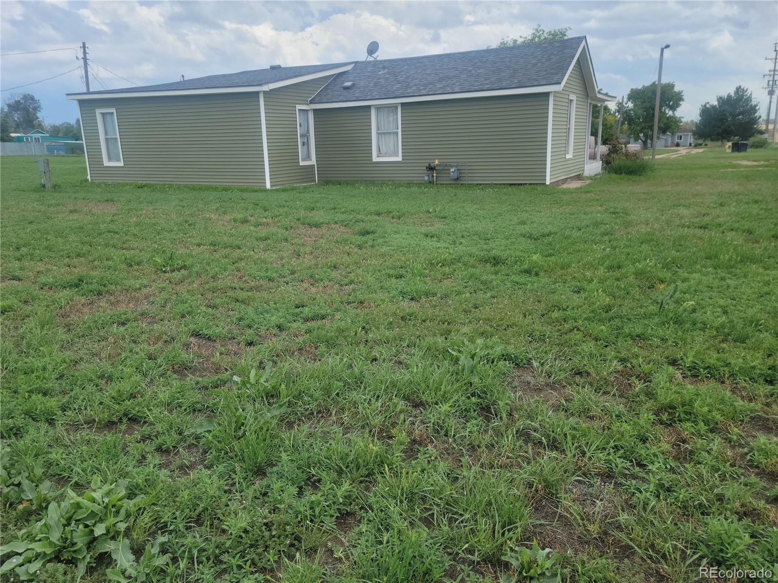7992 County Road 31 Fort Lupton, CO 80621 - Photo 14 of 14 a view of a house with a backyard